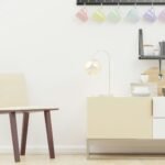 Bright minimalist Scandinavian kitchen interior with pastel cups and modern furniture.