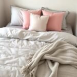 Creative College Dorm Room Ideas to Transform Your Space College dorm room with stylish bedding featuring plush pillows and a coordinated color scheme