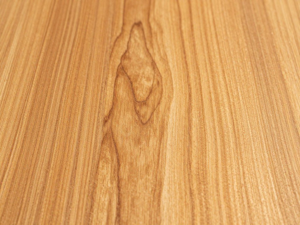 A close-up of teak wood grain showing the natural oils and beautiful texture A close-up of teak wood grain showing the natural oils and beautiful texture