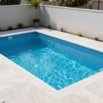 A stunning small backyard pool with modern landscaping in a compact space