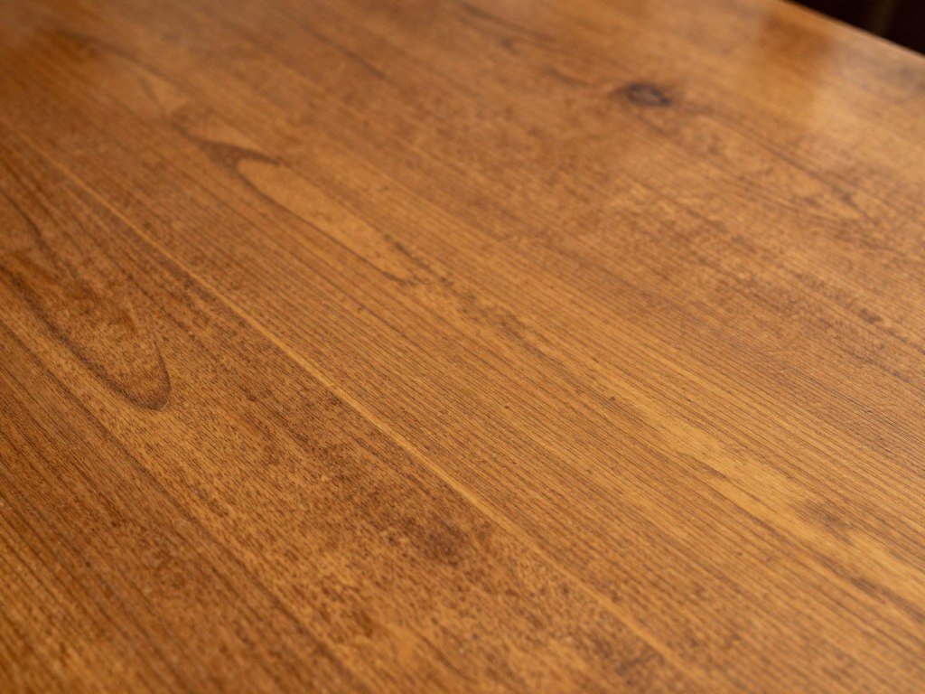 Close-up of vintage dining table showing patina and craftsmanship details
