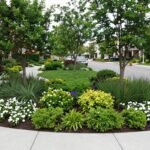 Corner lot landscaping front yard with curved garden beds and strategic plantings creating a beautiful transition between two street frontages