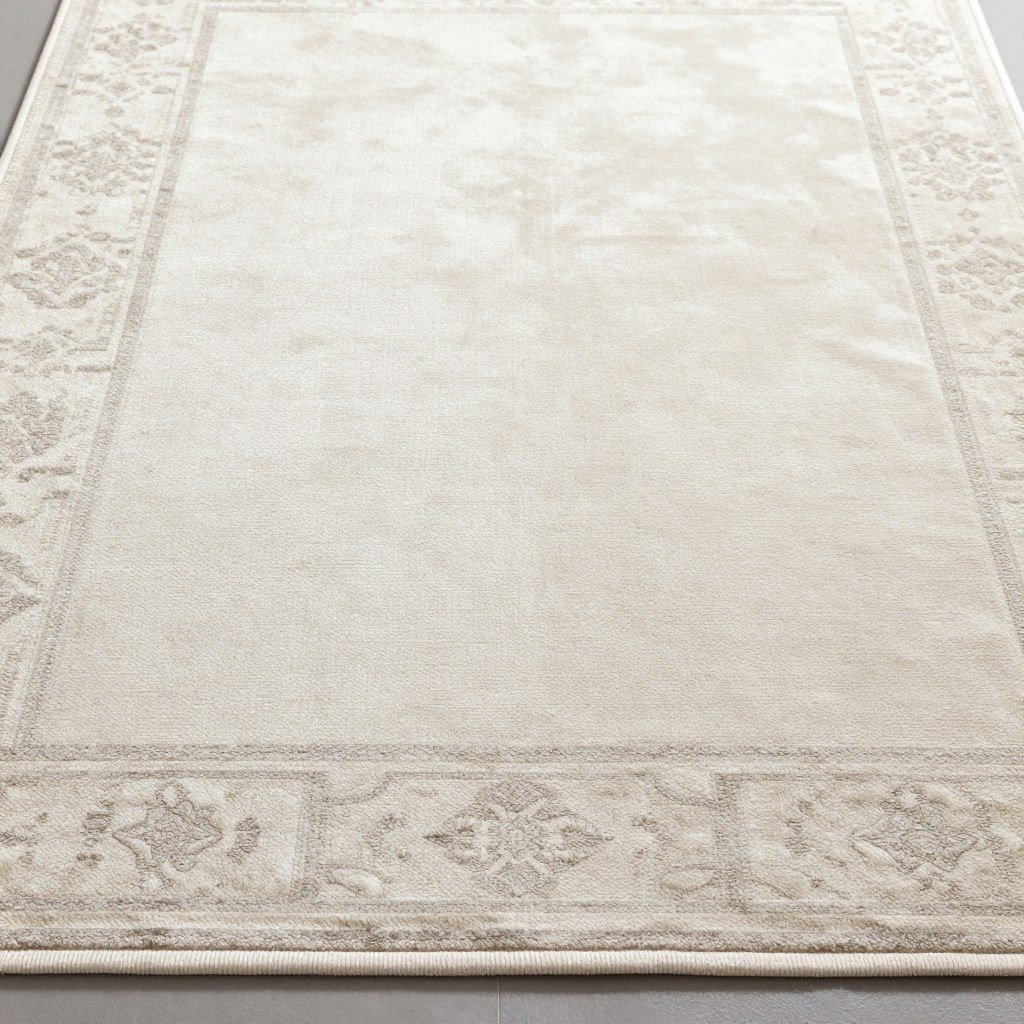 Elegant dining room with a luxurious polysilk rug in a subtle pattern