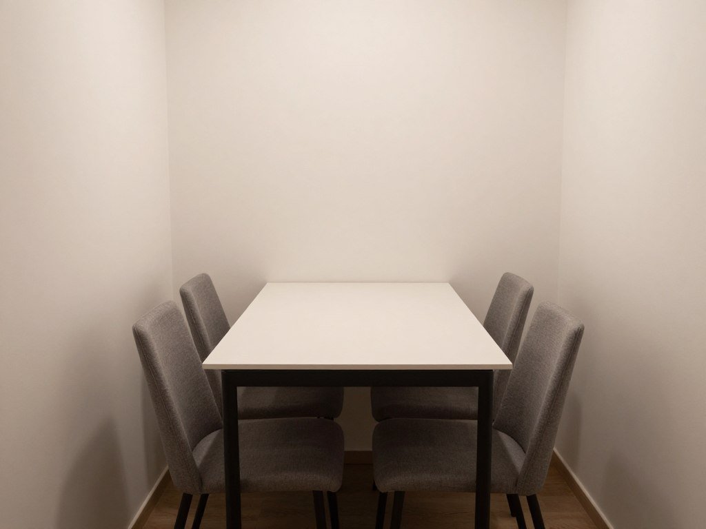 Small rectangular dining table against a wall