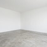 Clean, empty garage ready for transformation into a hang out space