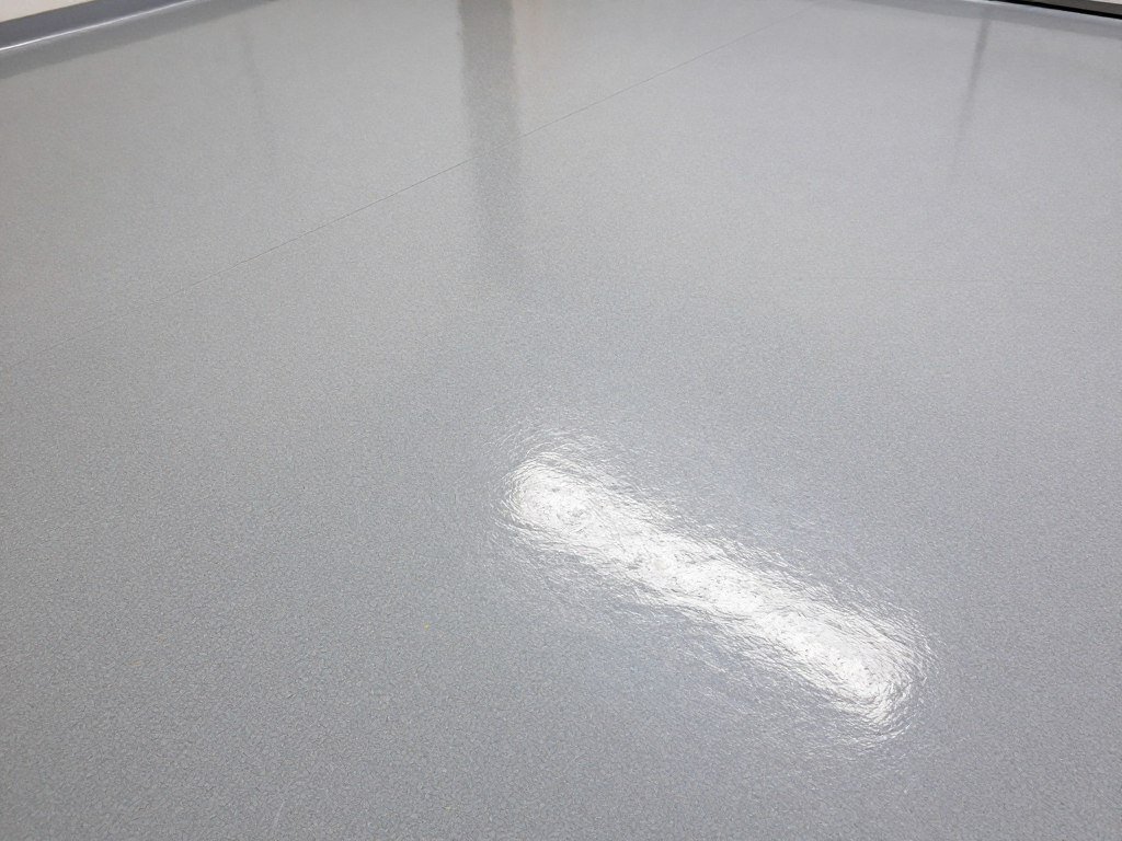 Close-up of polyaspartic garage floor showing clarity and durability