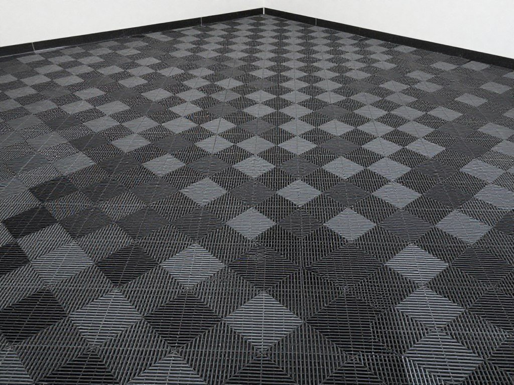Garage with interlocking floor tiles in black and gray pattern