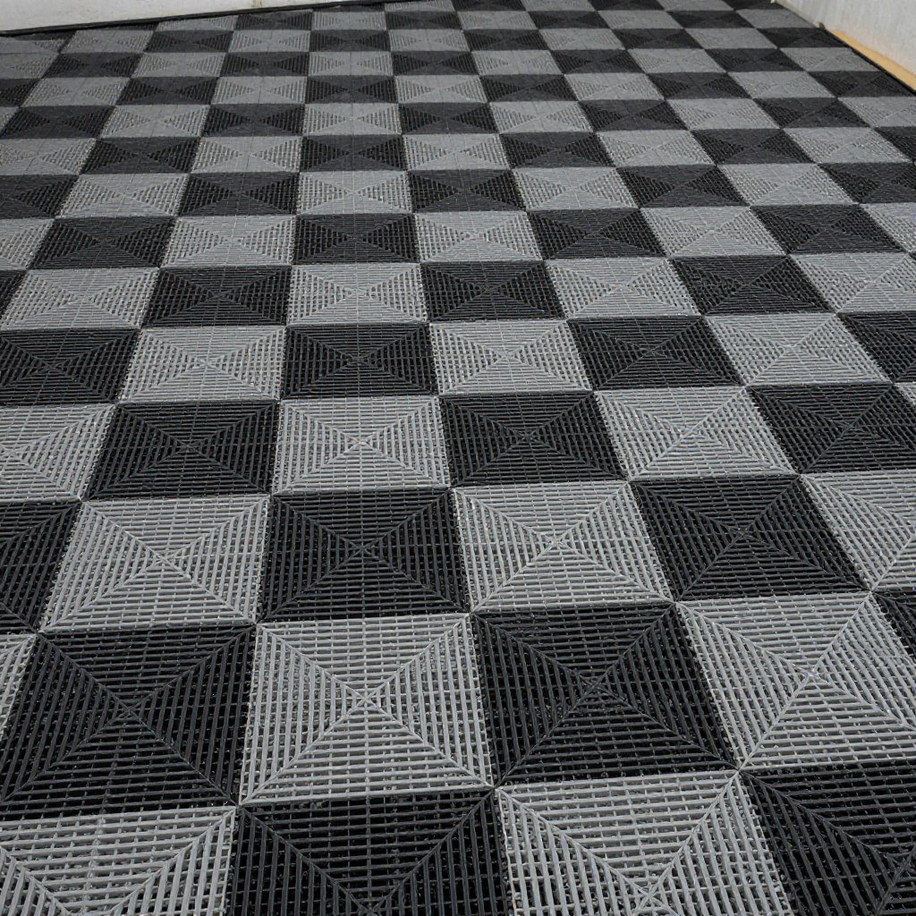 Interlocking garage floor tiles in a black and gray pattern creating a professional garage inspo look
