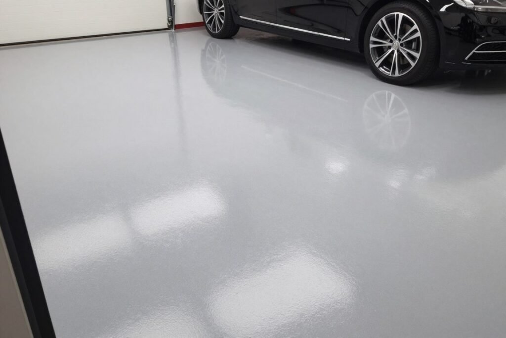 Modern garage interior with epoxy flooring in a sleek gray finish