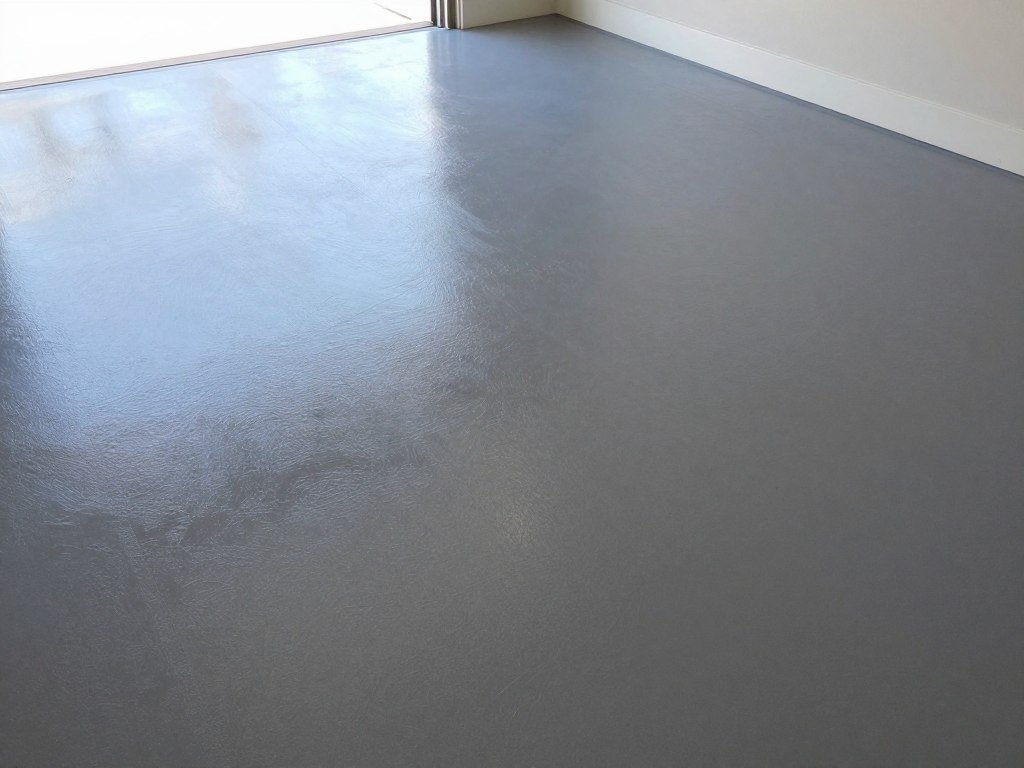 Transformed garage floor with modern epoxy coating in a stylish pattern