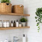 Small organized bathroom with white storage baskets and minimalist decor