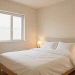 cozy small guest bedroom with minimalist furniture and warm lighting creating an inviting atmosphere