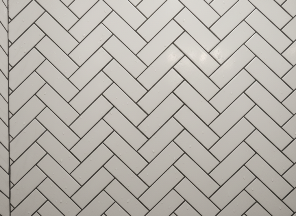 herringbone subway tile pattern detail in bathroom