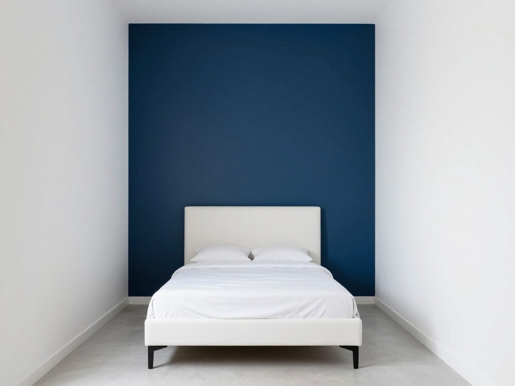 painted accent wall behind bed in small bedroom