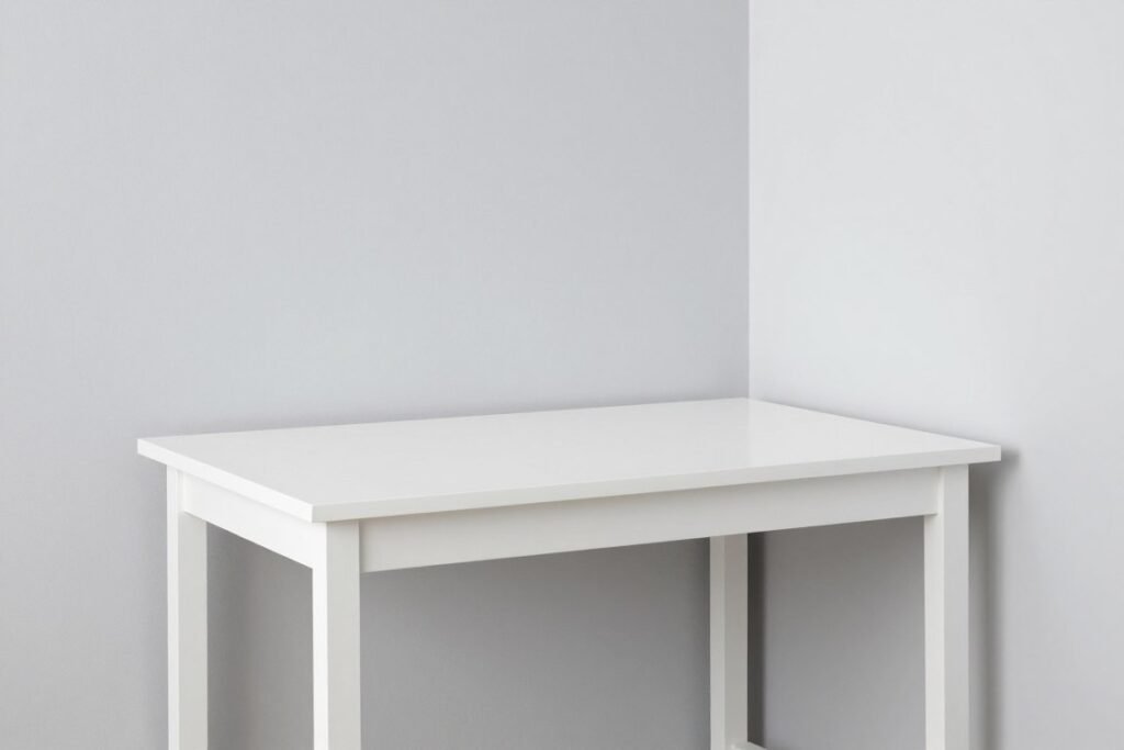 white minimalist desk blending with light colored walls